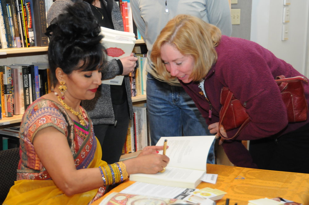  Gayathri signs books at her launch event at Powell